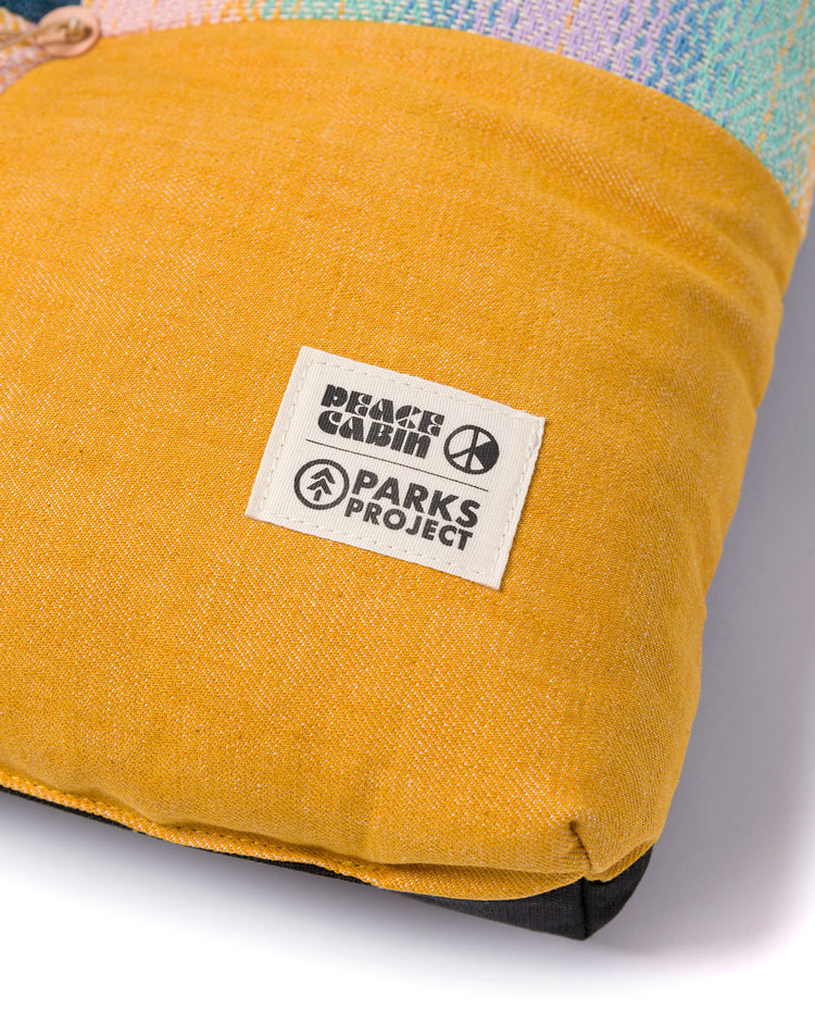 Shop Peace Cabin x Parks Project Wander At Sunrise Camp Cushion | yellow